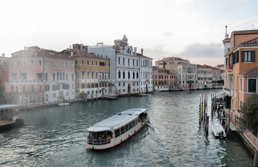 Venice waterway with old buildings and ferry